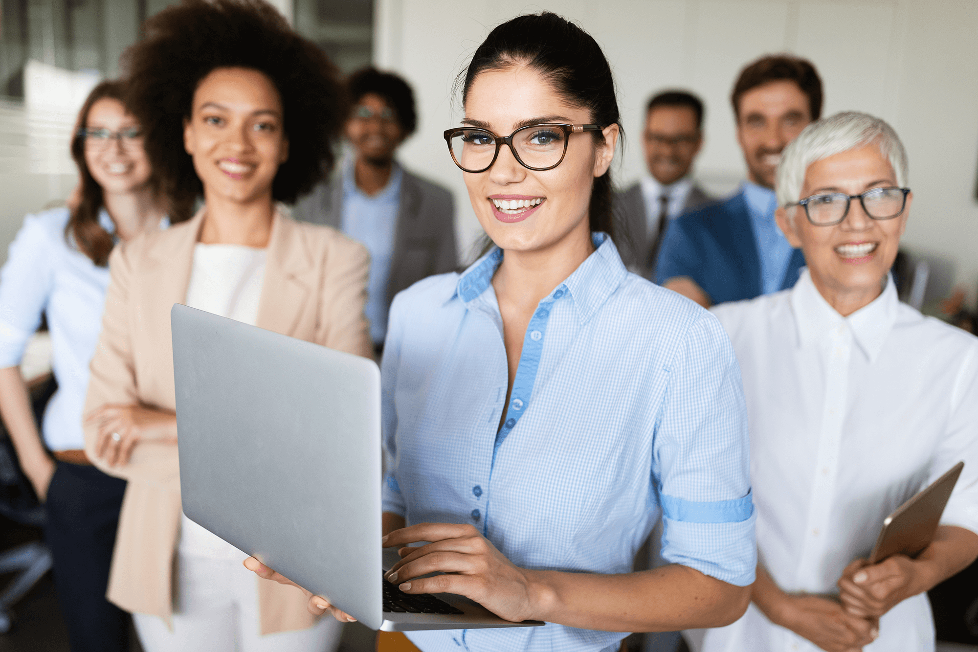 portrait-of-business-team-posing-in-office-NLFAGE9.png